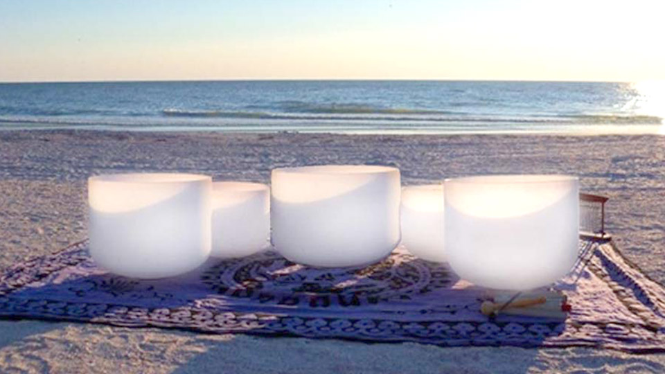 Crystal Singing bowl chakra set on Siesta Key Beach